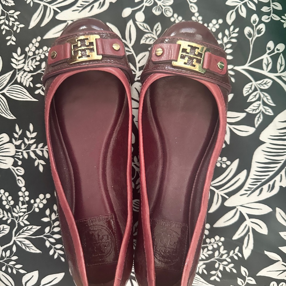 Tory Burch Maroon Flats with Rounded Toe and Gold Emblem